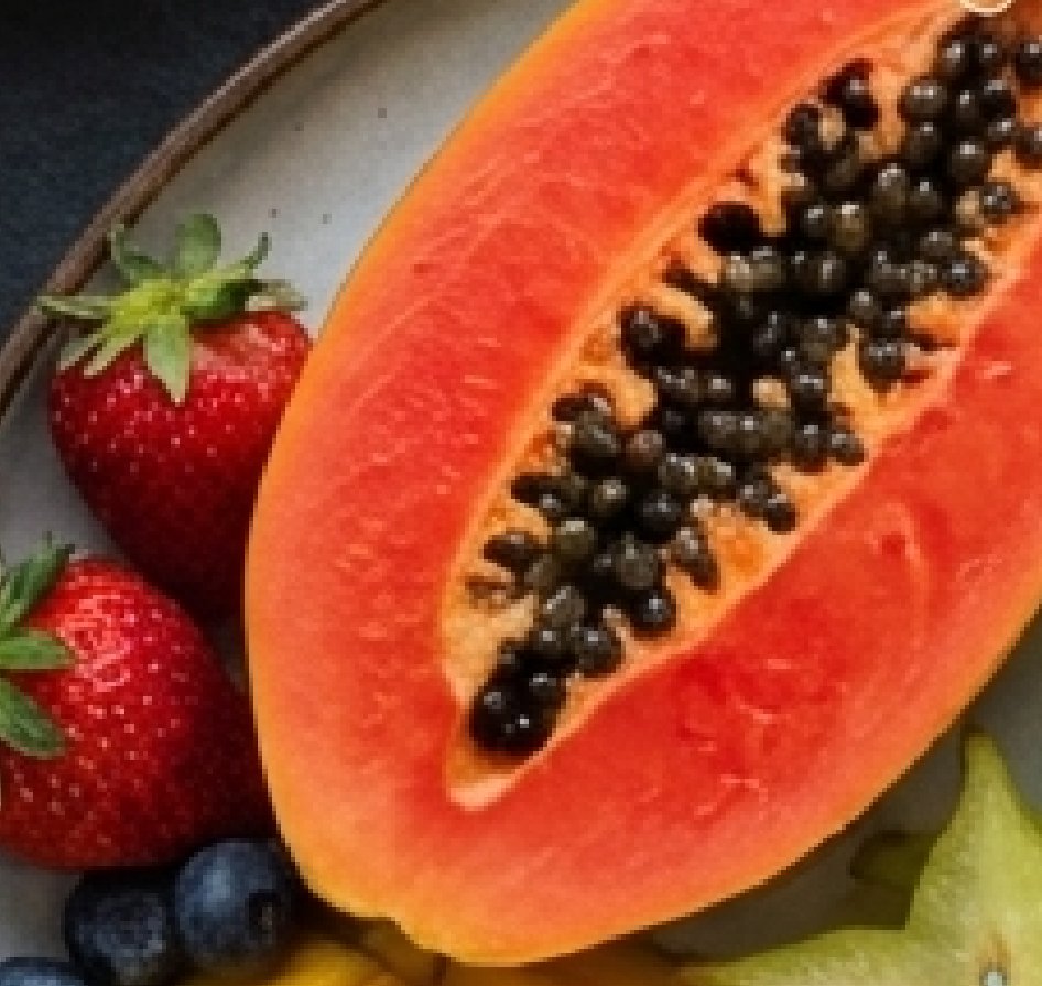 Tropical fruit plate with papaya, strawberries and pineapple